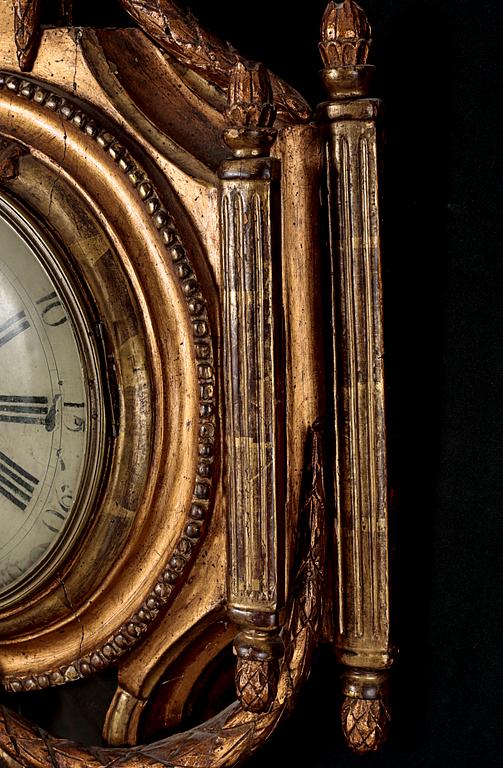 A Gustavian wall hanged clock, dial marked "Jacob Kock Stockholm", maded in the second half of the 18th century.