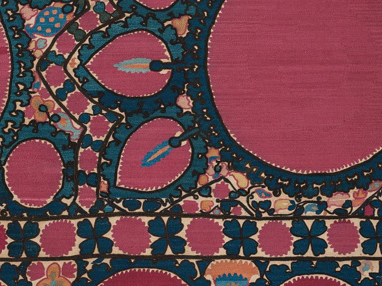 A SUZANI EMBROIDERY, an antique Tashkent, Uzbekistan, ca 217,5 x 112,5 cm.