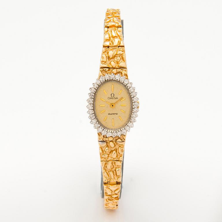 OMEGA, armbandsur, quartz, 14K guld, diamanter ca 0.38 ct tot. 18 mm.