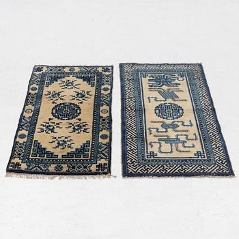 Two antique Chinese Pao-Tow rugs, c. 125 x 65 and 125 x 60 cm.