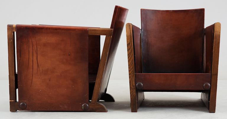 A pair of Axel Einar Hjorth brown leather 'Funkis' armchairs, Nordiska Kompaniet, Sweden ca 1930.