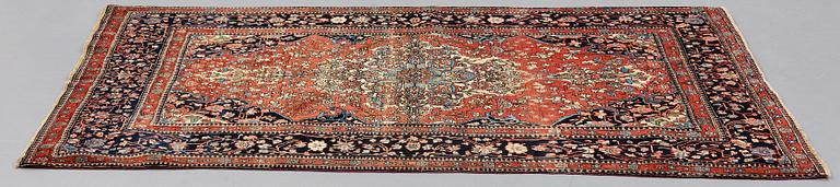 A RUG, an antique/semi-antique Kashan Motachem, ca 213 x 141,5 cm.