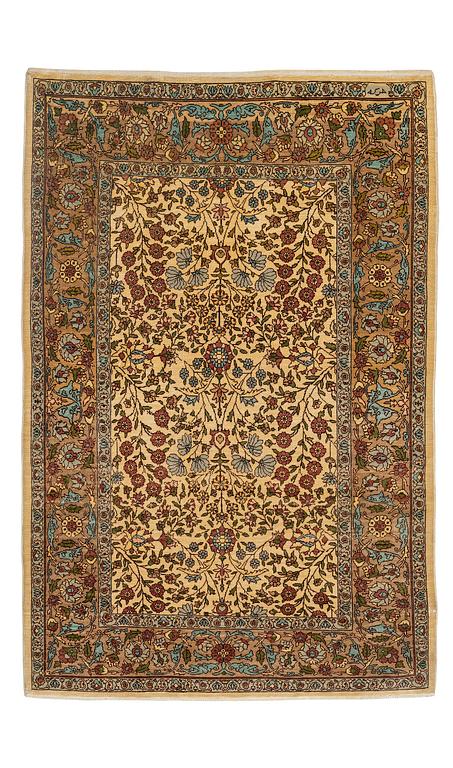 A silk Hereke rug, c. 112 x 74 cm.