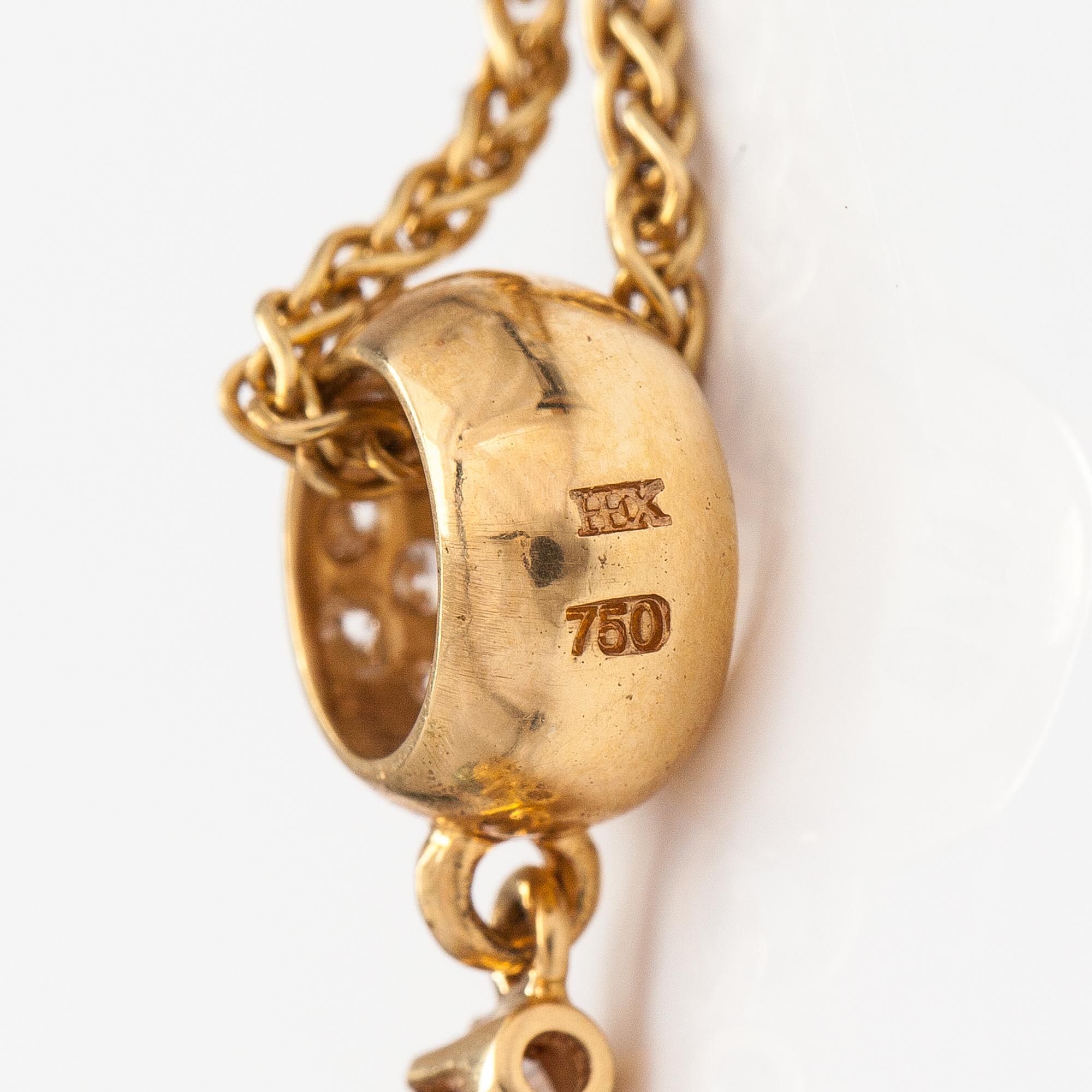 A 14K and 18K gold necklace with a tahiti pearl and diamonds ca. 0.72 ct in total. Ofelia jewelry, Helsinki.