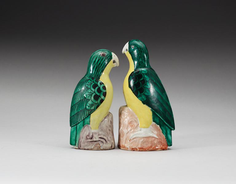 A set of two green and yellow glazed parrots, Qing dynasty, Jiaqing (1796-1820).