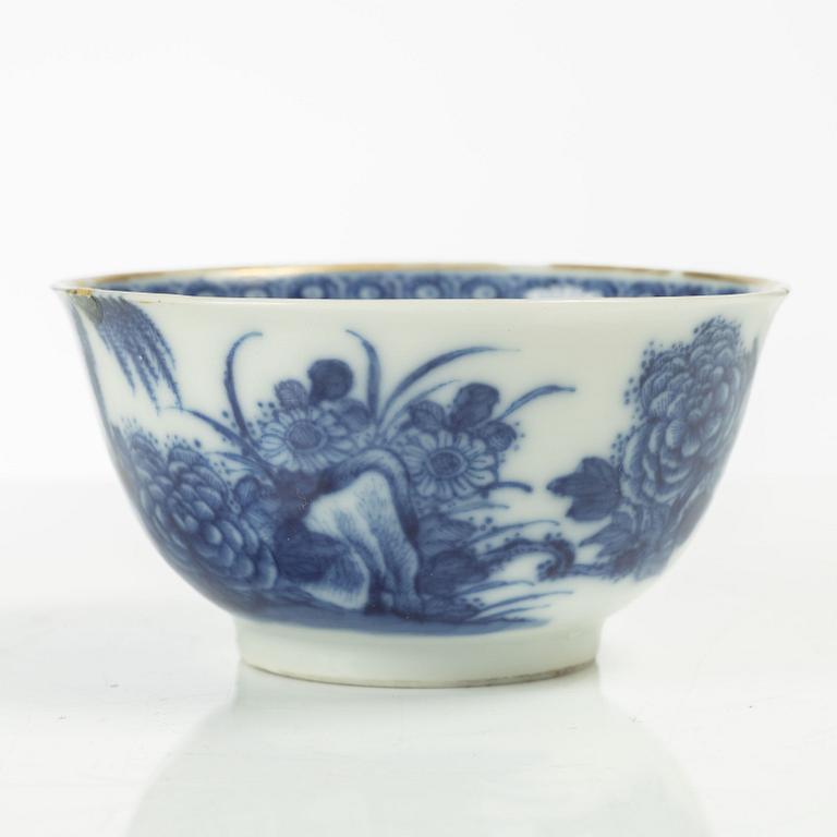 A Chinese soft paste cup with saucer, Qing dynasty, 18th century.