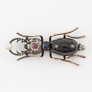 Brooch, in the form of an insect, 14K gold with garnet, diamonds, ruby, sapphire, and pearl.