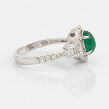 Cabochon cut emerald, baguette and brilliant cut diamond ring.