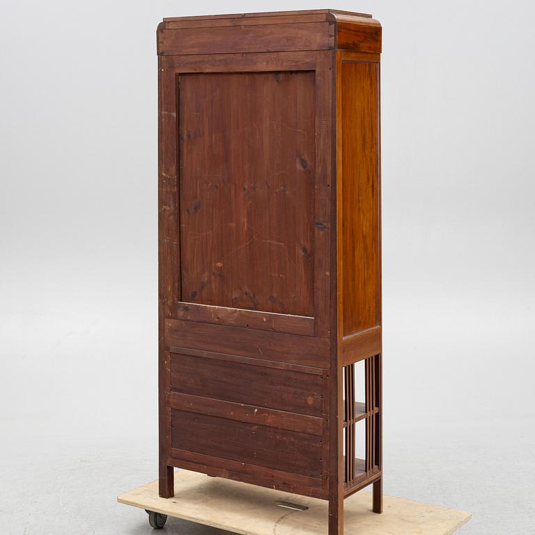 A display cabinet, early 20th Century.