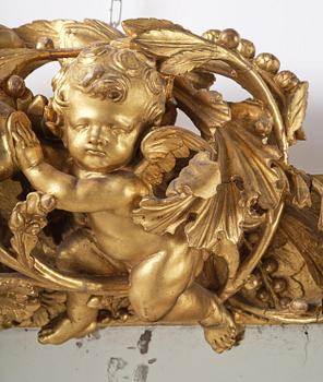 A presumably Dutch Louis XIV carved giltwood frame with mirror glass, in the style of Jean Le Pautre, late 17th century.