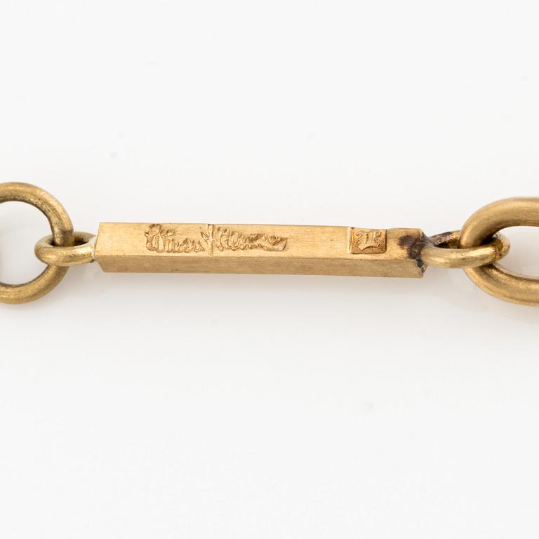 Wiwen Nilsson, an 18K gold necklace with a rock crystal pendant, Lund 1975.