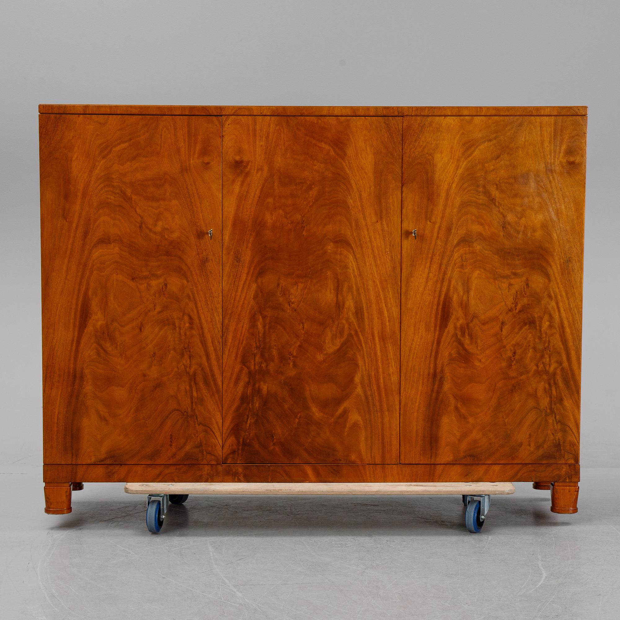 A 1940's Swedish Modern mahogany veneered cabinet.