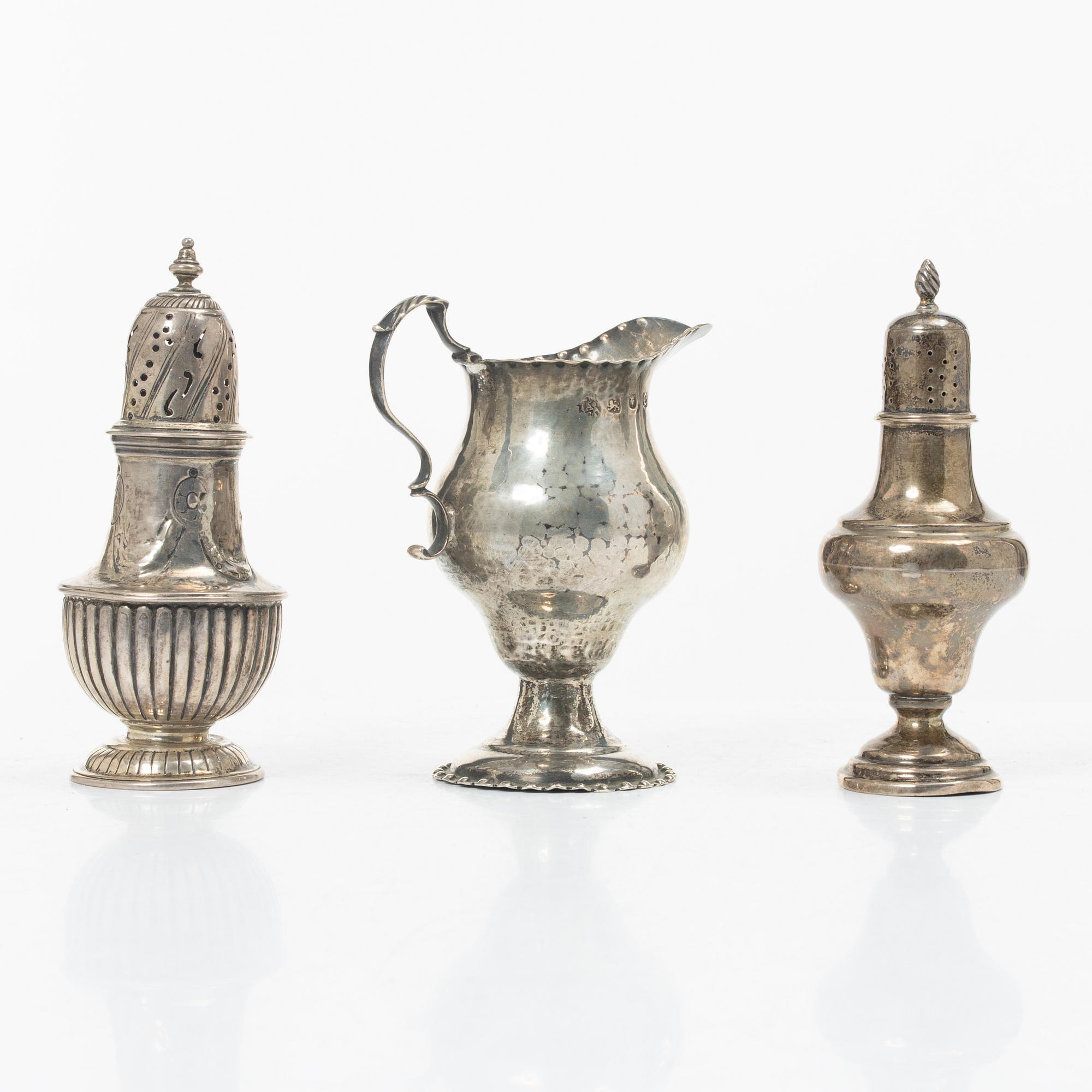 Two silver casters and cream jug, England.