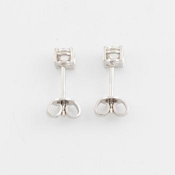 Brilliant cut diamond stud earrings.