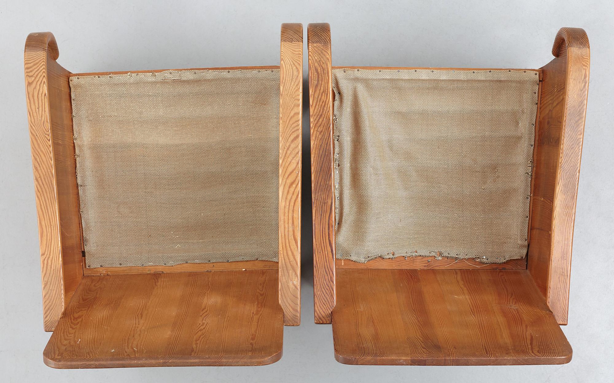Axel Einar Hjorth, attributed, a pair of stained pine "Lovö" easy chairs, Nordiska Kompaniet, Sweden 1930's.