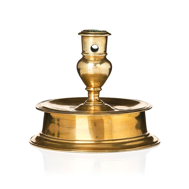 A Northern European baroque brass candlesticsk, late 17th century.