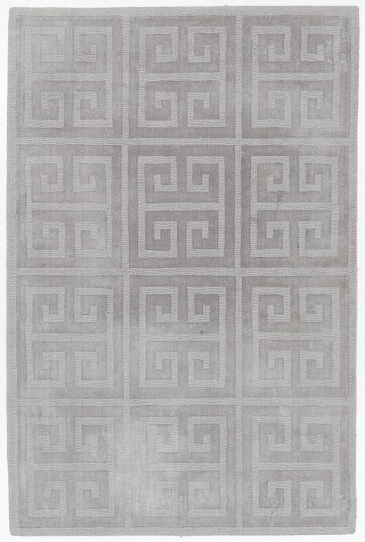 A 'Cubes' carpet, Layered, c. 270 x 180 cm.