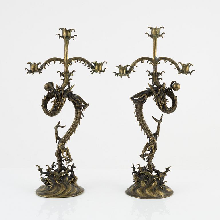 A pair of brass candelabra, Japan, early 20th century.