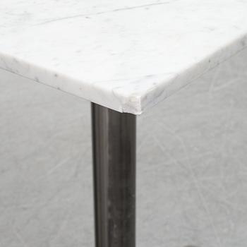 A marble top table, 21th century.