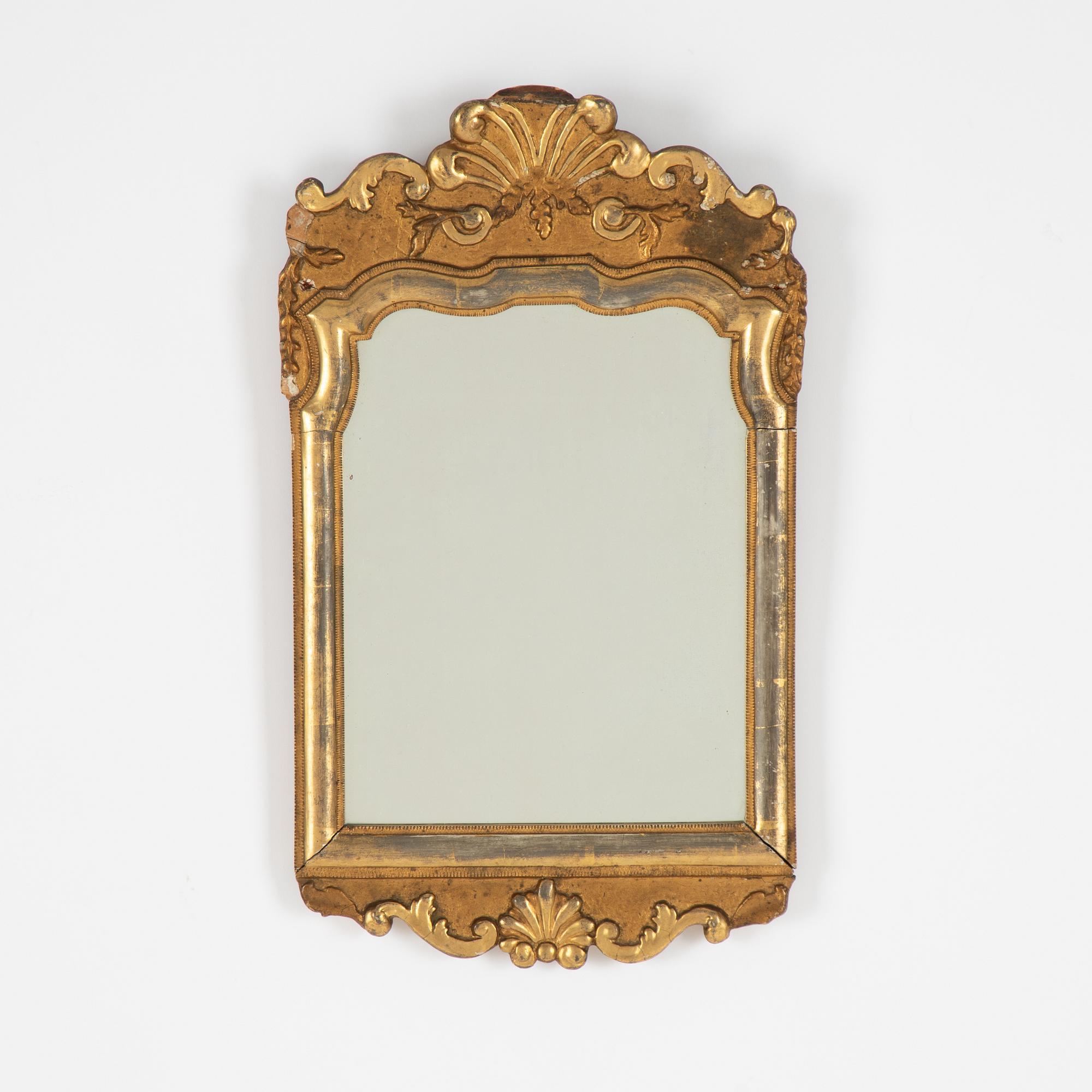 A Swedish rococo giltwood mirror, later part 18th century.
