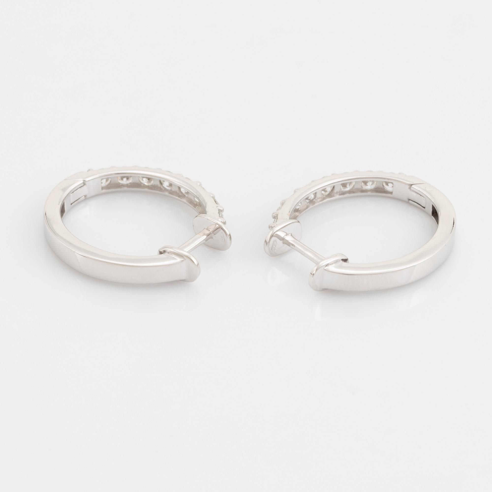 Brilliant cut diamond hoop earrings.