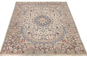 A Nain carpet, part silk, 9 laa, c. 300 x 195 cm.