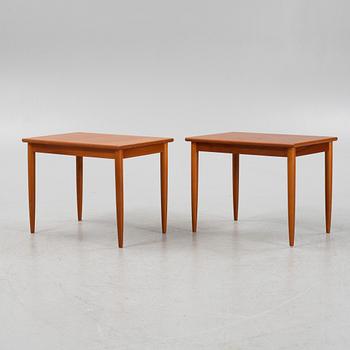 A pair of teak veneered side tables, second part of the 20th Century.