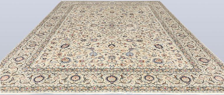 A Keshan carpet, signed, approx. 410 x 323 cm.