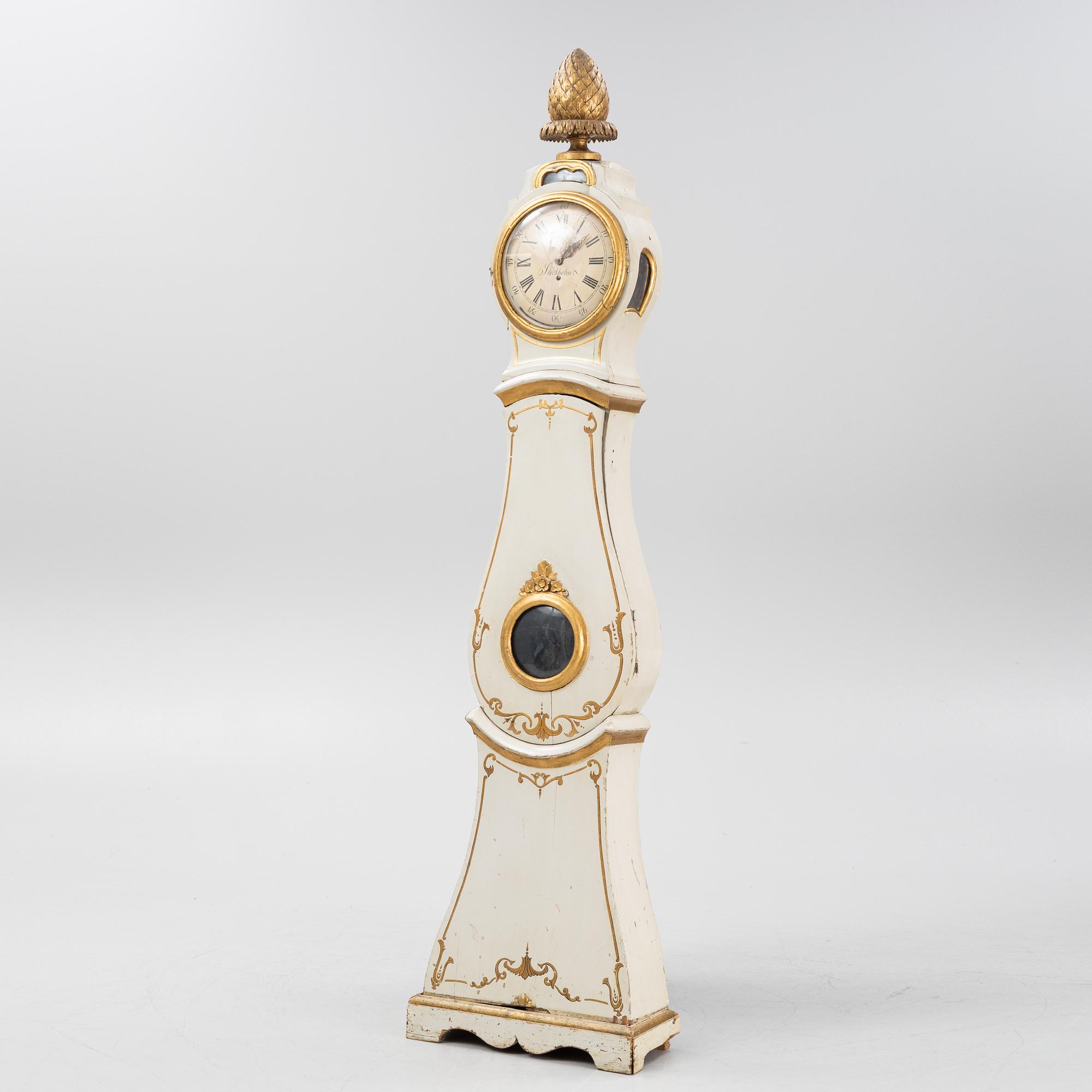 A long-case clock, 19th century.