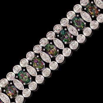ARMBAND, sterlingsilver, vita och färgade topaser tot ca 25.00 ct.