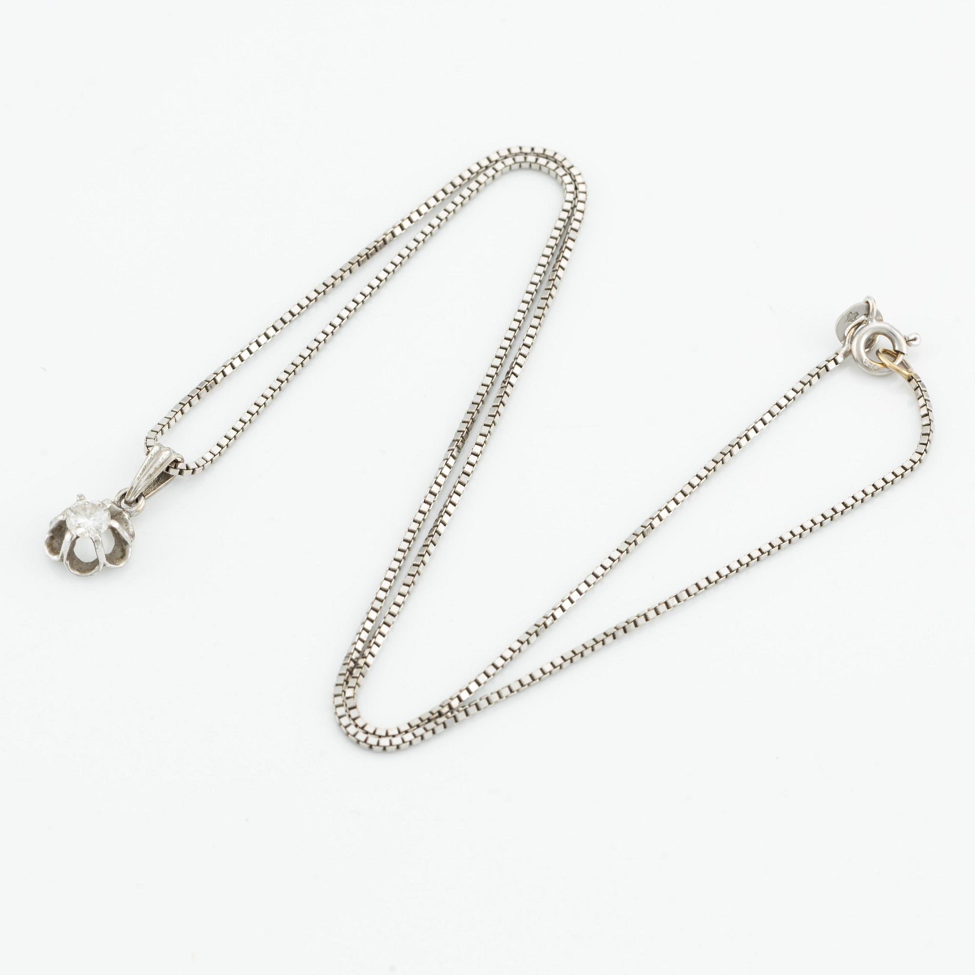 Hänge och kedja 18K vitguld med en rund briljantslipad diamant.