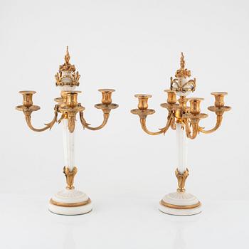 A pair of Louis XVI-style marble and gilt-bronze four-light candelabra, late 19th century.