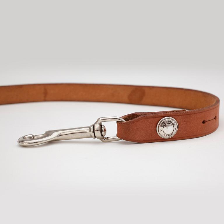 HERMÈS, a natural leather dog leash.