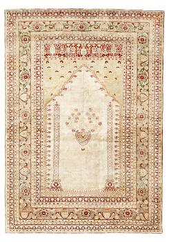 227. A RUG, an antique silk Tabriz, ca 165 x 118,5-111,5 cm.