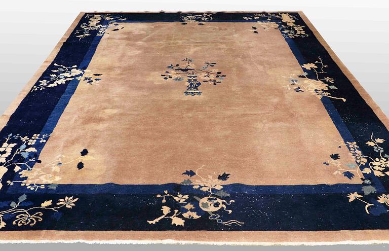 A CARPET, semi-antique China, art deco, around 345 x 272 cm.