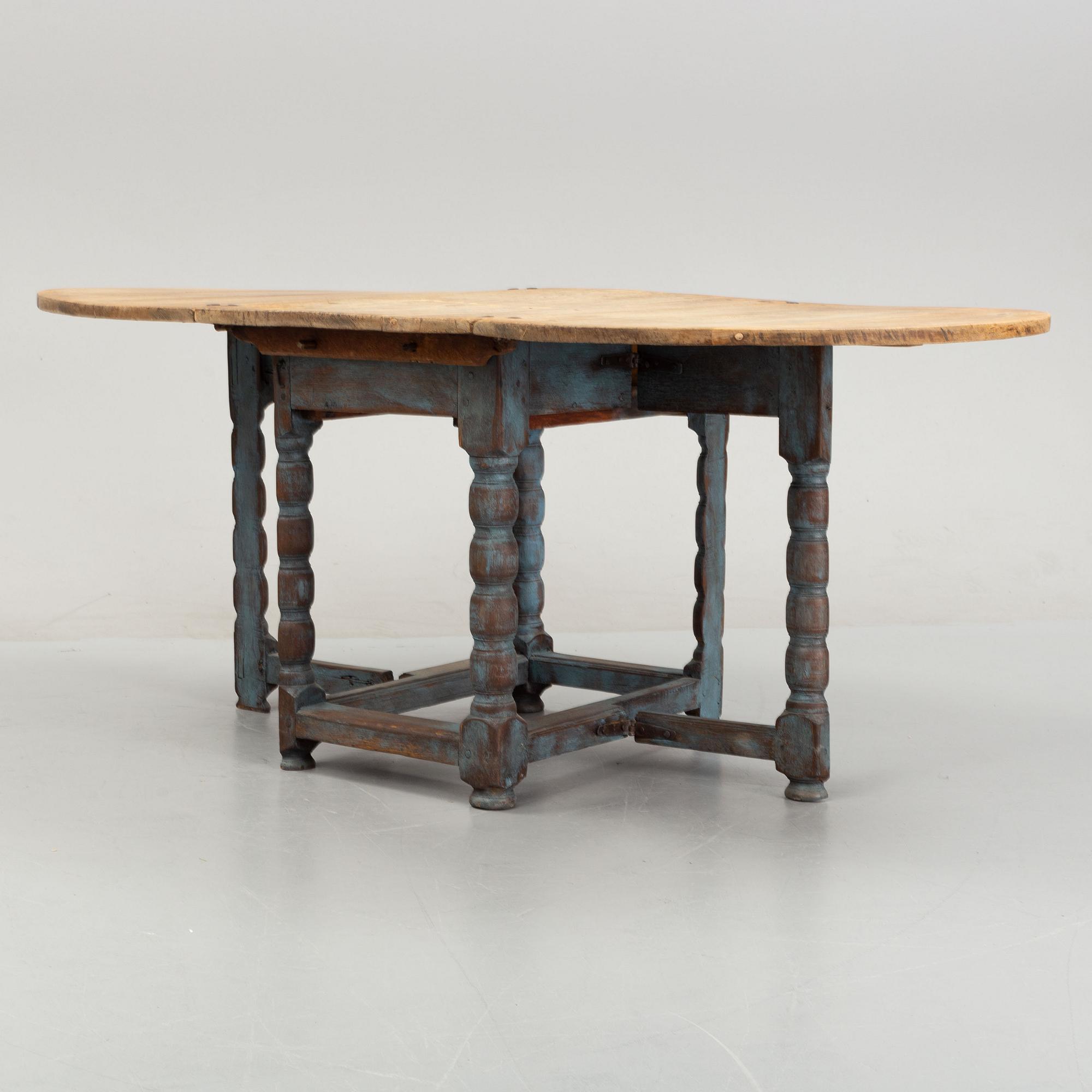 A 19th Century painted gate leg table.