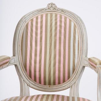 A pair of Gustavian open armchairs by E. Öhrmark (master in Stockholm 1777-1813).