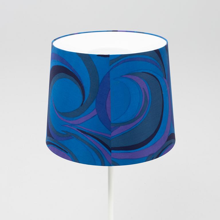 A white metal floor light, Luxus, Vittsjö.