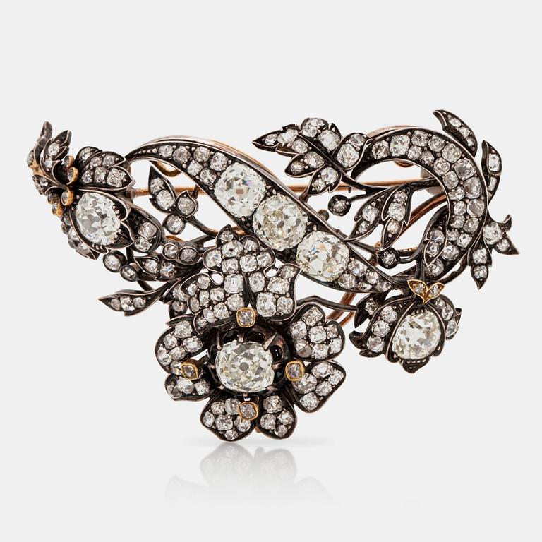 A late 19th century floral brooch set with old cut diamonds, total carat weight circa 10.00 cts.