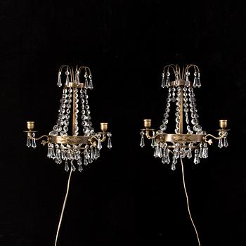 A pair of 20th century Gustavian style wall lights for two candles.