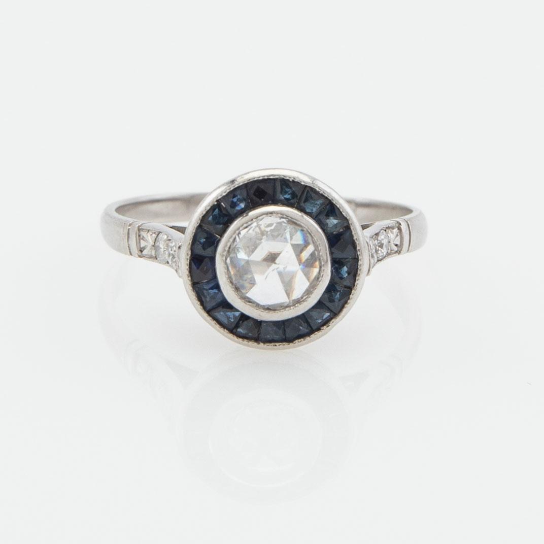 Halo ring, platinum with rose-cut diamond and sapphires.