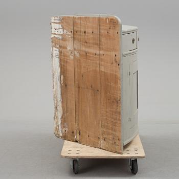 A mid 19th century corner sideboard.