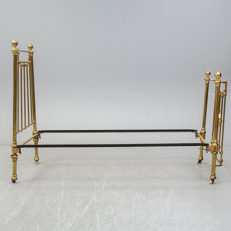 A late 19th or early 20th century bedframe.