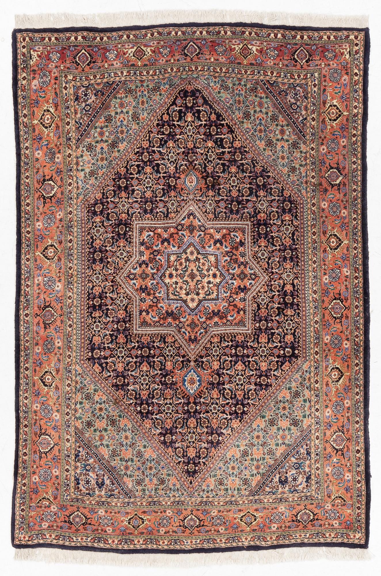 An oriental rug, approx. 203 x 135 cm.