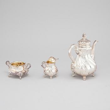 A silver coffee pot, creamer and sugar bowl with swedish import marks, 1930s.