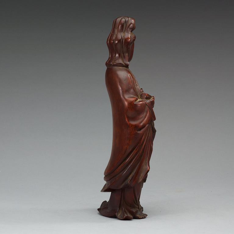 A wooden figure of Guanyin, China, early 20th Century.