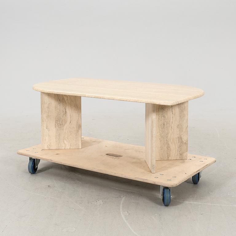 A 21st century travertine coffee table.