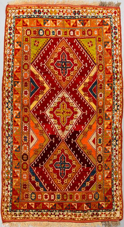 An antique/semi-antique Anatolian rug, around 260 x 127 cm.