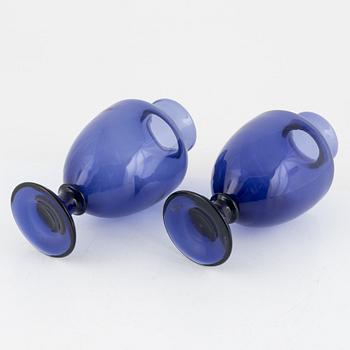A matched pair of blue glass vases from around the year 1900.