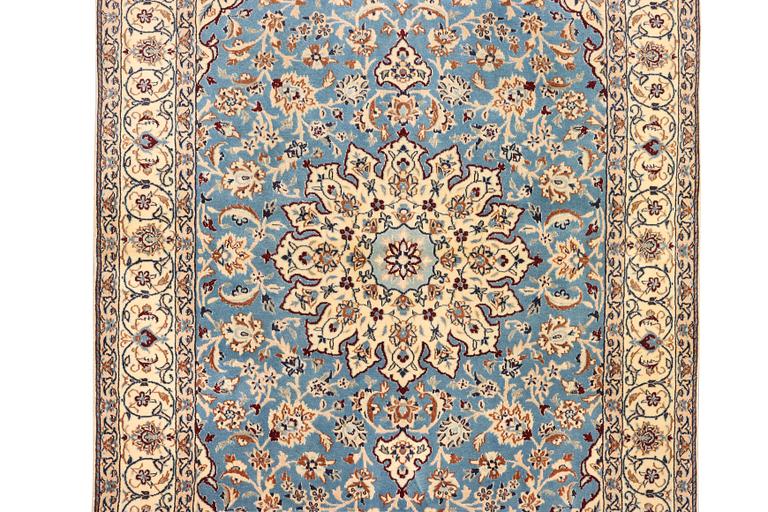 A Nain, part silk carpet, c. 196 x 120 cm.